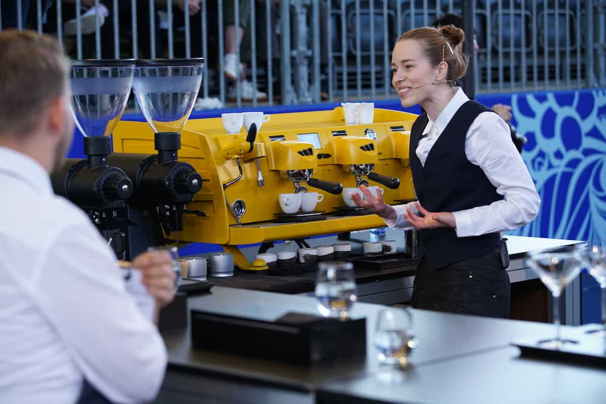 Lily, founder of ATRI, presenting coffee in the World Barista Championship finals